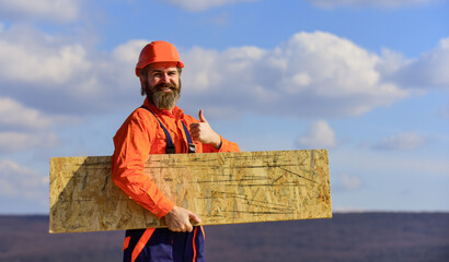 roof industrial. Roofer contractor laying rooftop with protective helmet. man roofer inspecting...