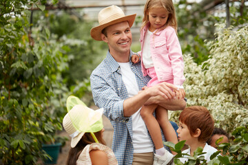 beautiful children on excursions in the wild garden or greenhouse, they are intersted in natural phenomena and its manifestations