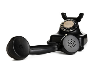Vintage telephone, receiver off-hook, isolated on white background