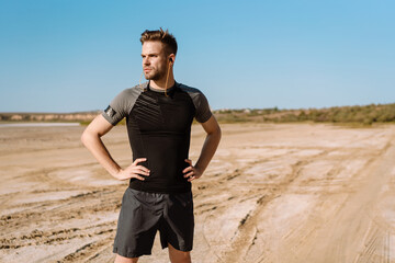 Portrait of a fit sportsman listening to music