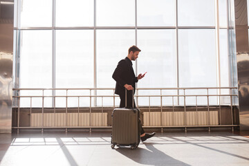 Man using a novel navigaion app in the airport