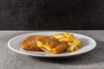 San Jacobo steak filled with cheese and ham on gray stone