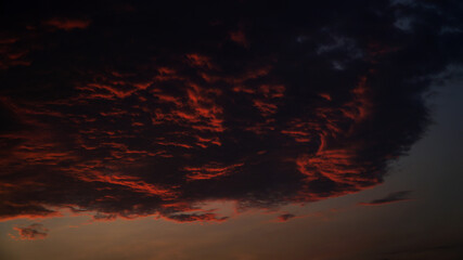 Fototapeta premium Dusk with orange clouds exposed to the sun