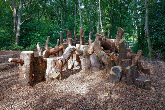 Natural play area or woodland den constructed with sustainably felled oak tree trunks on Chorleywood Common, Hertfordshire, England, UK

