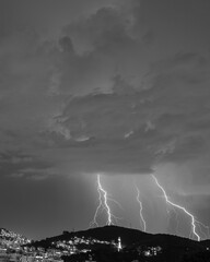 Images of the arrival of a strong summer storm with lightning and rain. Event in the city in the...