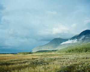 landscape with mountains and cloudy sky