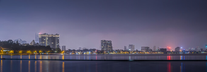Fototapeta na wymiar City of Hanoi at night as seen from West Lake