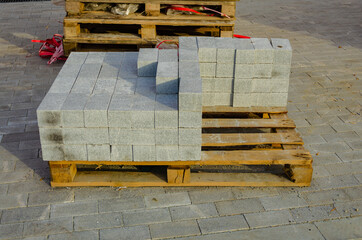 Tiles for road repairs on a pallet.