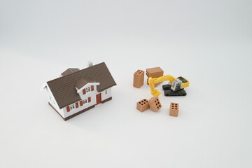 maison tractopelle et briques