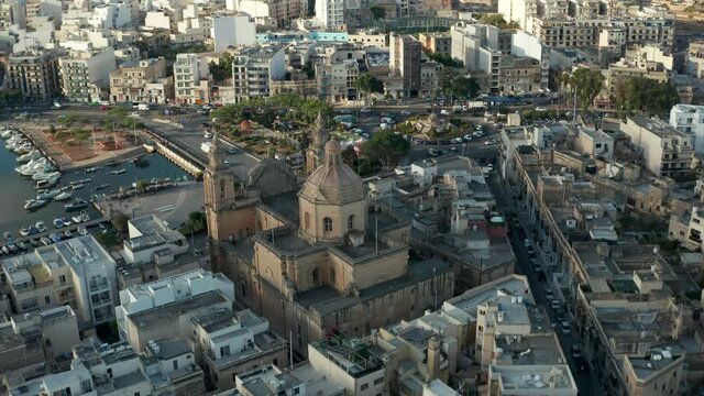 Majestic Beautiful Brown Catholic Church in Msida Town, Malta from Aerial Drone perspective