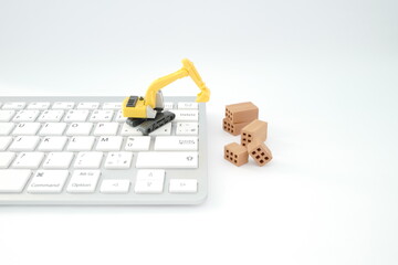 clavier tractopelle et briques