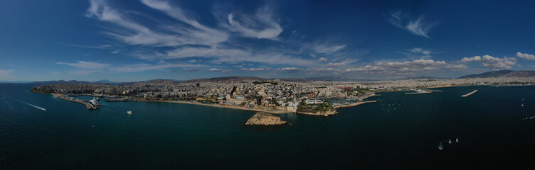 Fototapeta na wymiar Aerial drone panoramic photo of iconic round port and marina of Zea in the heart of Piraeus with beautiful sky and clouds, Attica, Greece