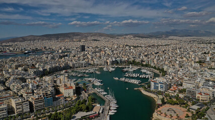 Aerial drone panoramic photo of iconic round port and marina of Zea in the heart of Piraeus with beautiful sky and clouds, Attica, Greece