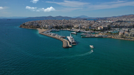 Obraz premium Aerial drone panoramic photo of iconic round port and marina of Zea in the heart of Piraeus with beautiful sky and clouds, Attica, Greece