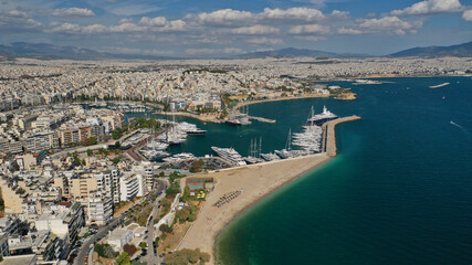 Aerial drone panoramic photo of iconic round port and marina of Zea in the heart of Piraeus with beautiful sky and clouds, Attica, Greece