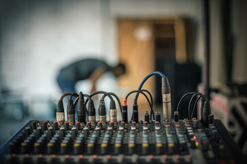 Behind the scene. Sound technician electric engineer adjusting sound elements backstage. Control...