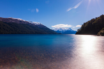 Long exposure shot of Menendez'  lake during spring season against Torrecillas glacier in Los Alerces National Park, Patagonia, Argentina