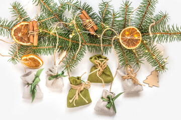 Christmas advent calendar gift zero waste eco Care package,furoshiki gifts environmentally friendly gift wrapping craft paper fir branches, Christmas Eve,ecological concept eco-friendly xmas