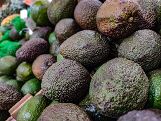 Group of fresh avocados sell at market