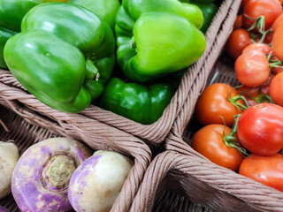 Group of various bell peppers sold on a market