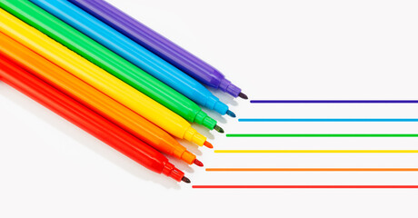 Markers of rainbow colors isolated on white background