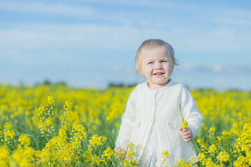 girl in a field of yellow flowers