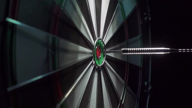 Three darts in the bull's eye on the Dartboard.