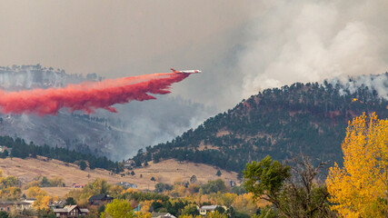 Air tankers drop firefighting retardant on the Cal Wood Fire northwest of Boulder, Colorado.