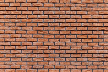 Obraz premium Old brown stone brick wall seamless background and pattern texture