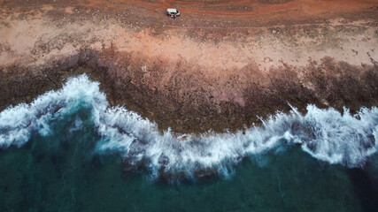 aerial view of camper in front of the beach