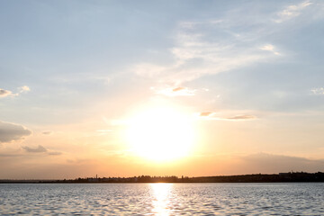 Picturesque view of beautiful sunrise on riverside. Morning sky