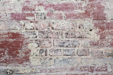 Background of wide old brick wall texture. Home or office design backdrop. Close-up texture. 