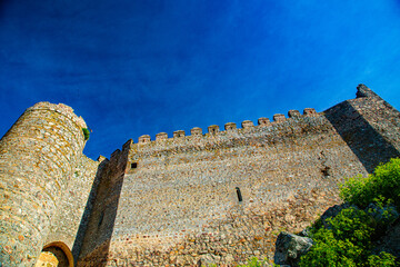 Great castle entrance wall built on rock base