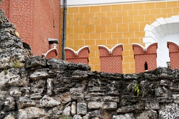 Close up view on aged stones of grotto by battlements of Kremlin wall