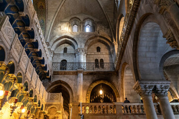 Church of the Holy Sepulchre interior, main entrance hall with cloisters of Calvary or Golgotha Chapel in Christian Quarter of historic Old City of Jerusalem, Israel