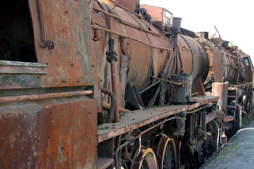 Fototapeta na wymiar Old rusty steam locomotive. Vintage railroad