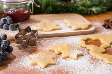 Making Christmas cookies. Christmas tree and star shape biscuits