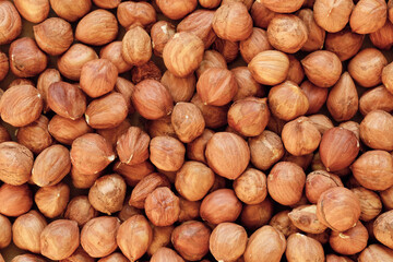 Macro shot of many peeled Hazelnuts. Concept of autumn harvesting. Natural and organic food full of vitamins. Seasonal vegetarian nutrition.
