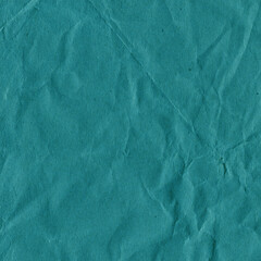 Obraz premium Blue vintage and old looking crumpled paper background. Retro cardboard texture. Grunge paper for drawing. Ancient book page. Present wrapping.