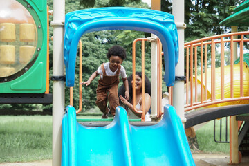 Active African little boy afro hair enjoy playing outdoors, Happy 3 Years kid having fun together...