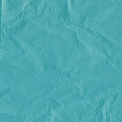 Blue vintage and old looking crumpled paper background. Retro cardboard texture. Grunge paper for drawing. Ancient book page. Present wrapping.
