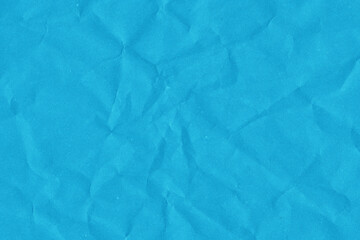 Obraz premium Blue vintage and old looking crumpled paper background. Retro cardboard texture. Grunge paper for drawing. Ancient book page. Present wrapping.