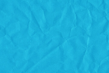 Obraz premium Blue vintage and old looking crumpled paper background. Retro cardboard texture. Grunge paper for drawing. Ancient book page. Present wrapping.