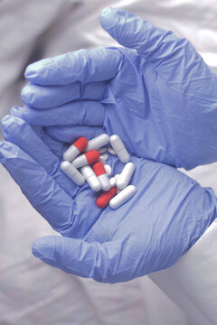capsules and tablets in hand stock photo