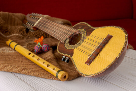 Andean string and wind musical instruments. Charango and quena.