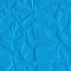 Blue vintage and old looking crumpled paper background. Retro cardboard texture. Grunge paper for drawing. Ancient book page. Present wrapping.