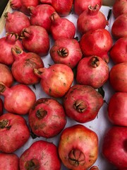 Fototapeta na wymiar Ripe juicy pomegranates on the market macro