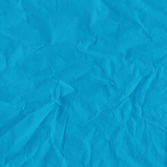 Blue vintage and old looking crumpled paper background. Retro cardboard texture. Grunge paper for drawing. Ancient book page. Present wrapping.