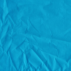 Fototapeta premium Blue vintage and old looking crumpled paper background. Retro cardboard texture. Grunge paper for drawing. Ancient book page. Present wrapping.
