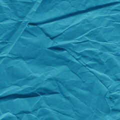 Blue vintage and old looking crumpled paper background. Retro cardboard texture. Grunge paper for drawing. Ancient book page. Present wrapping.